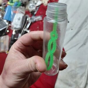 small plastic bubble blower, likely a 60 ml bottle